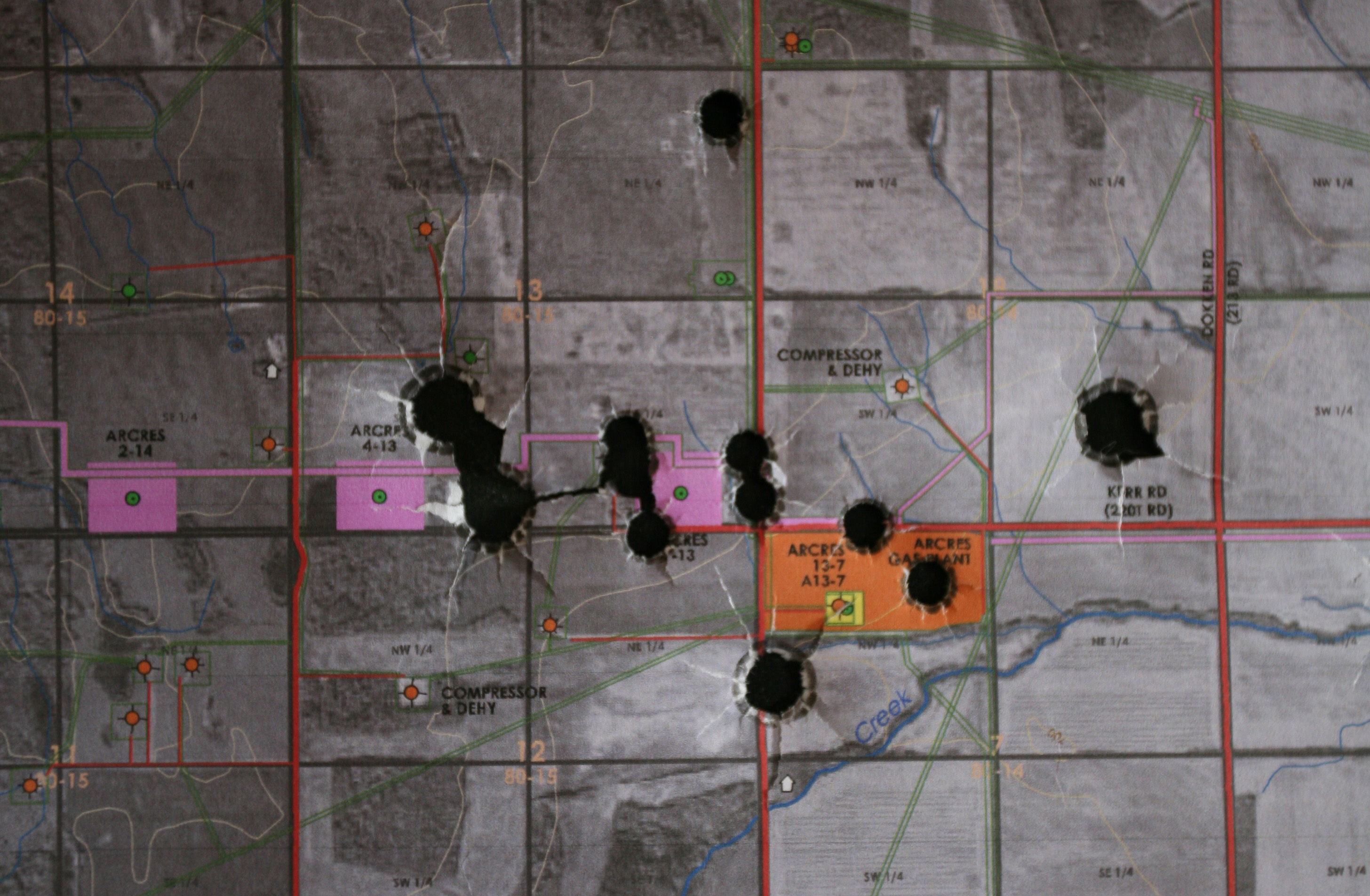 Karl Mattson, Plan / Response, 2016. Oil and gas compiled plan map, Winchester 30/30, Marlin 45/70 (detail). Image courtesy the artist.